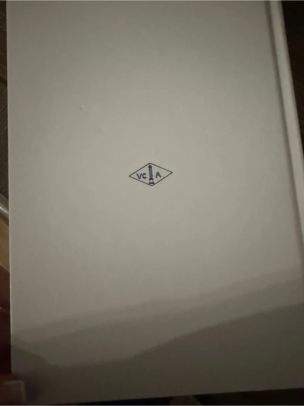Van Cleef & Arpels White Book with Blue Title and Red Illustration
